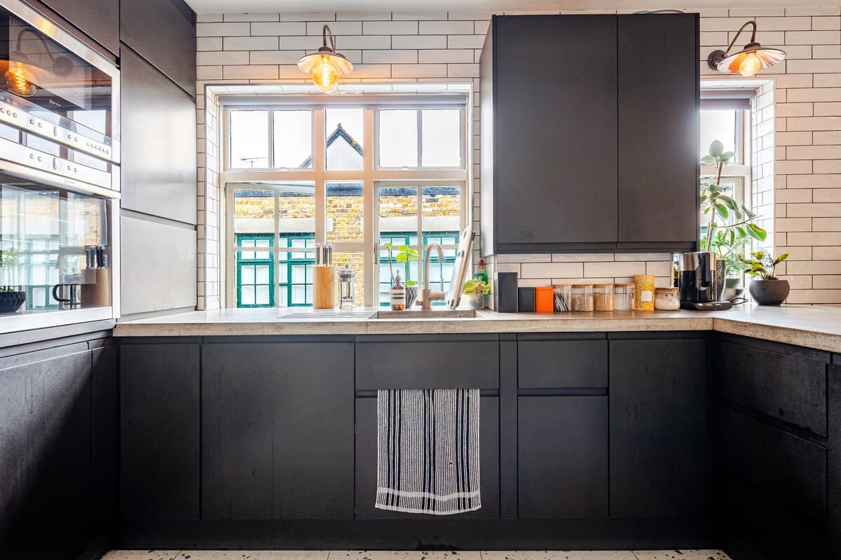 Kitchen with white tile backsplash